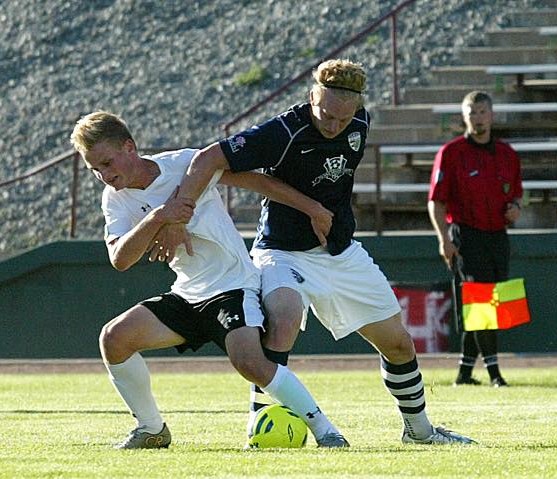 Elijah Hurt, at left, battles a South Sound FC opponent for the ball at Sargent Field in Chelan in Wenatchee FC's final match of the 2015 season. (Patty Gillin)